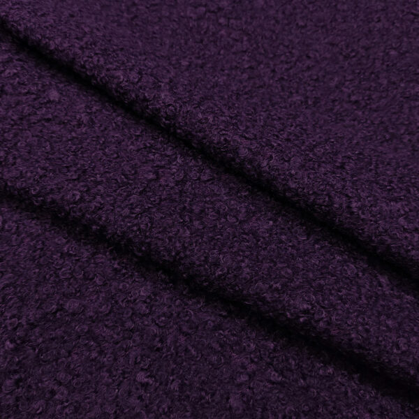 Tessuto per cappotto bouclé tinta unita viola scuro