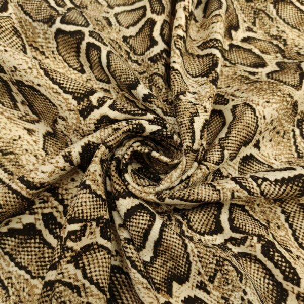 Tessuto Punto Milano a fantasia motivo animalier beige - nero
