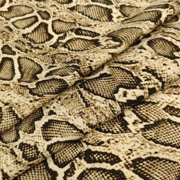 Tessuto Punto Milano a fantasia motivo animalier beige - nero