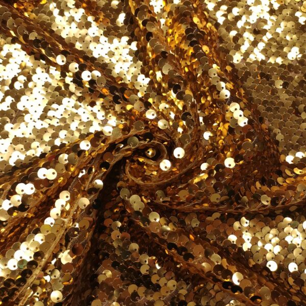Tulle elasticizzato ricamato con paillettes grandi oro