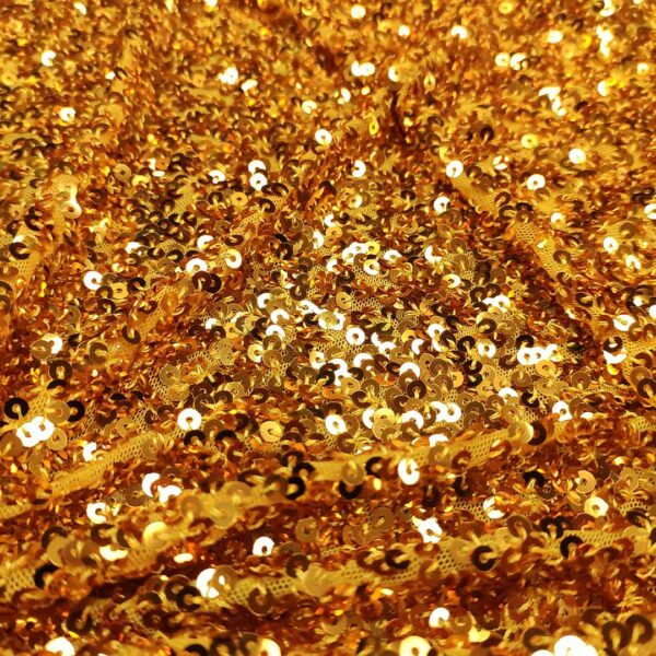 Tessuto tulle elasticizzato ricamato con paillettes ocra