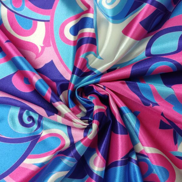 Tessuto Lycra lucida a fantasia motivo astratto fucsia - azzurro - rosa