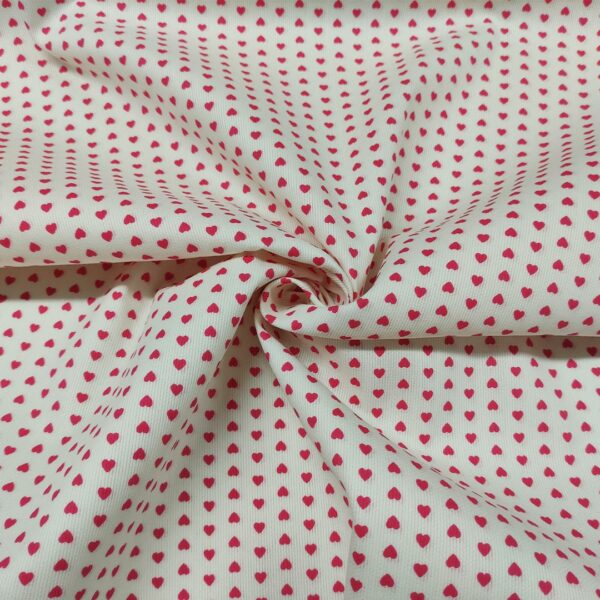 Tessuto Millerighe di Cotone a fantasia motivo cuori grandi panna - fucsia