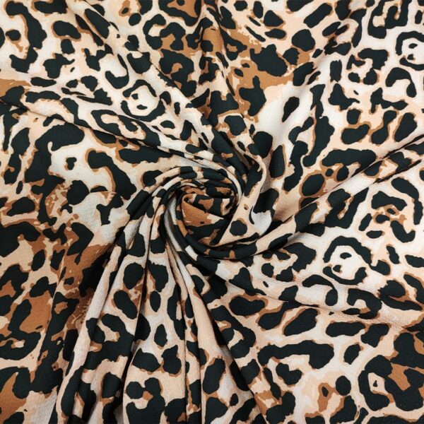 Tessuto Crepe a fantasia motivo animalier beige - nero