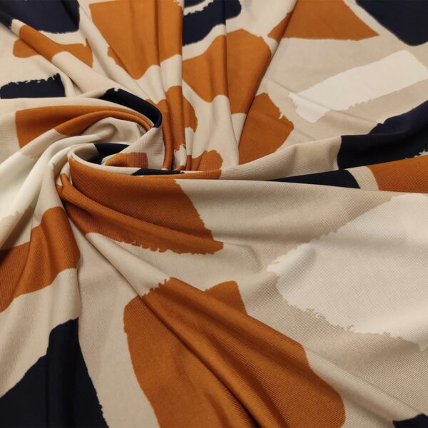 Tessuto Jersey a fantasia motivo astratto beige - ruggine - blu