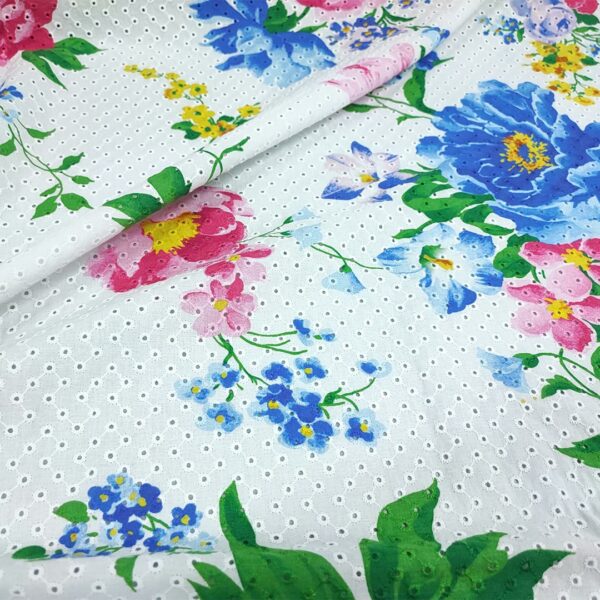 Tessuto Sangallo a fantasia motivo floreale bianco - bluette - fucsia
