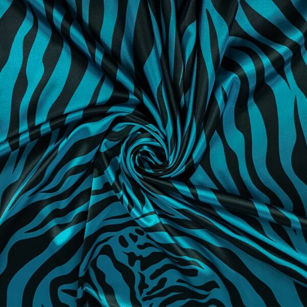 Tessuto Satin elasticizzato a fantasia motivo animalier verde ottanio - nero