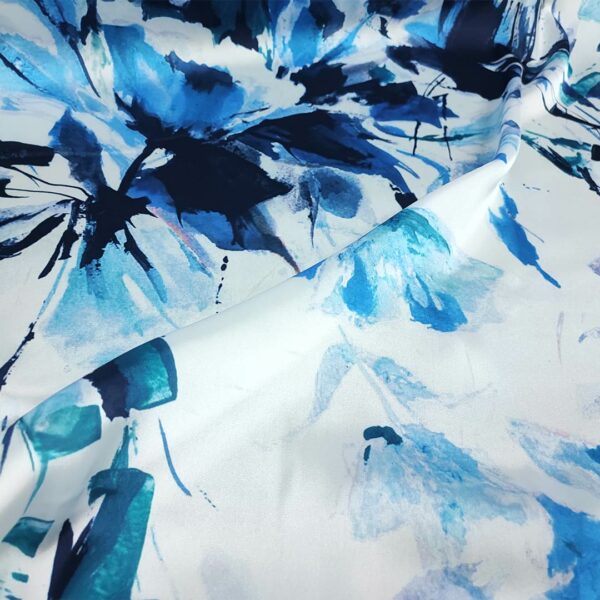 Tessuto Satin elasticizzato a fantasia motivo floreale bianco - turchese - blu