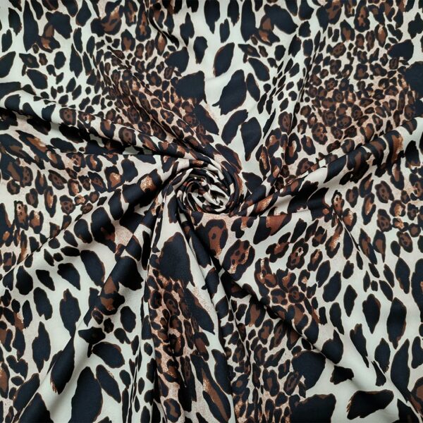 Tessuto Cady elasticizzato a fantasia motivo animalier nero - marrone - panna