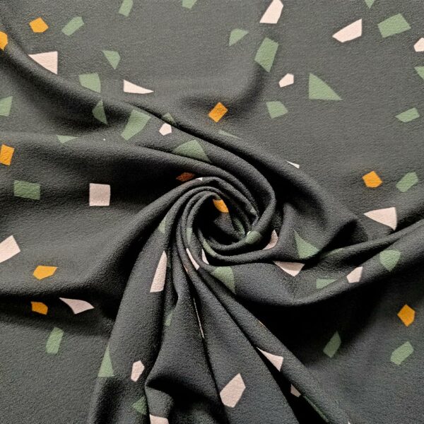 Tessuto Crepe elasticizzato a fantasia motivo astratto nero - ocra - rosa