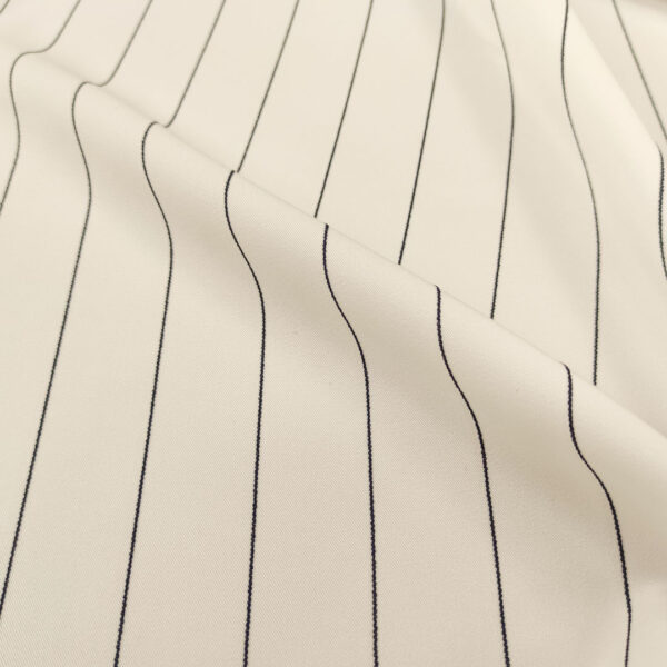 Tessuto Crepe elegance elasticizzato a fantasia motivo rigato bianco - nero
