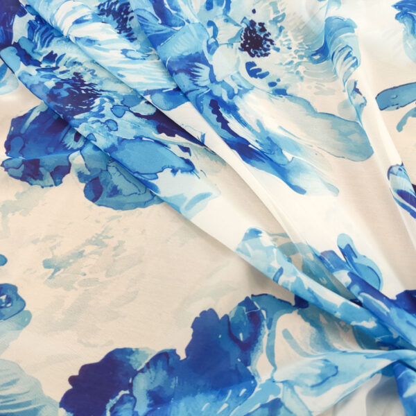 Tessuto Georgette a fantasia motivo floreale bianco - blu elettrico