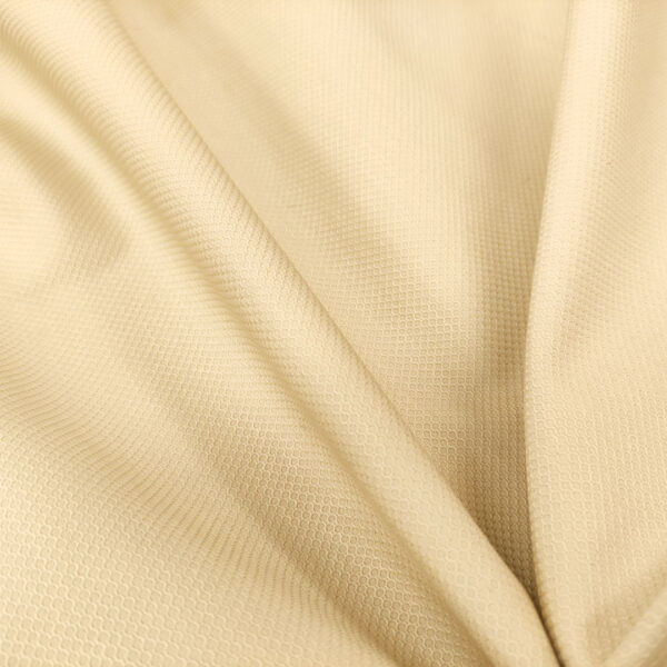 Tessuto piquet di cotone elasticizzato tinta unita beige chiaro