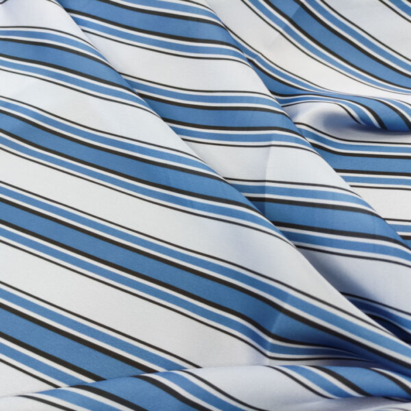 Tessuto Satin a fantasia motivo rigato celeste - azzurro - nero