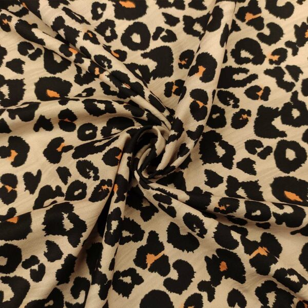 Tessuto Crepe elasticizzato a fantasia motivo animalier beige - arancio  - nero