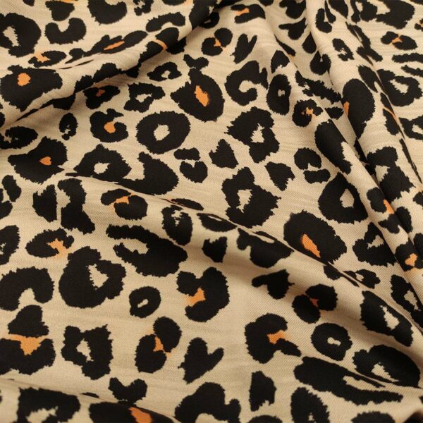 Tessuto Crepe elasticizzato a fantasia motivo animalier beige - arancio  - nero