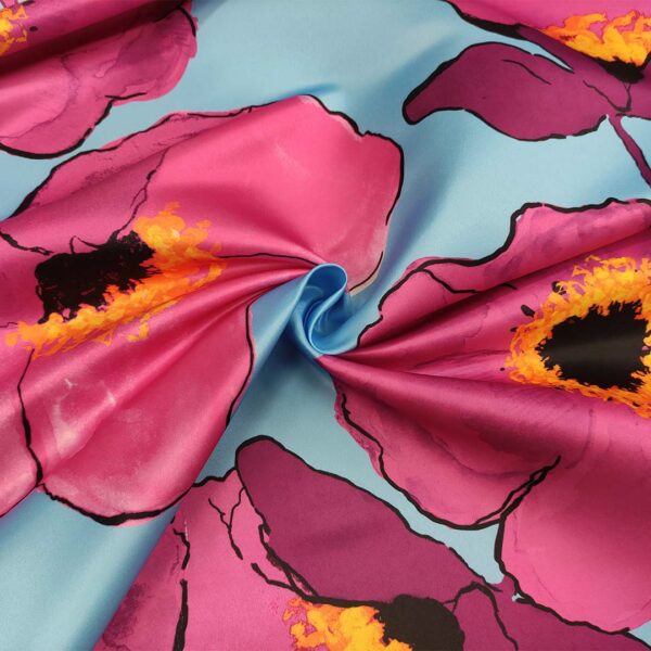 Tessuto Duchesse a fantasia motivo floreale celeste - fucsia