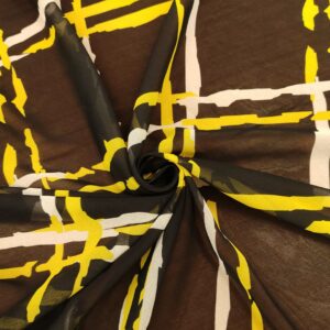 Tessuto Georgette a fantasia motivo astratto nero - giallo - bianco