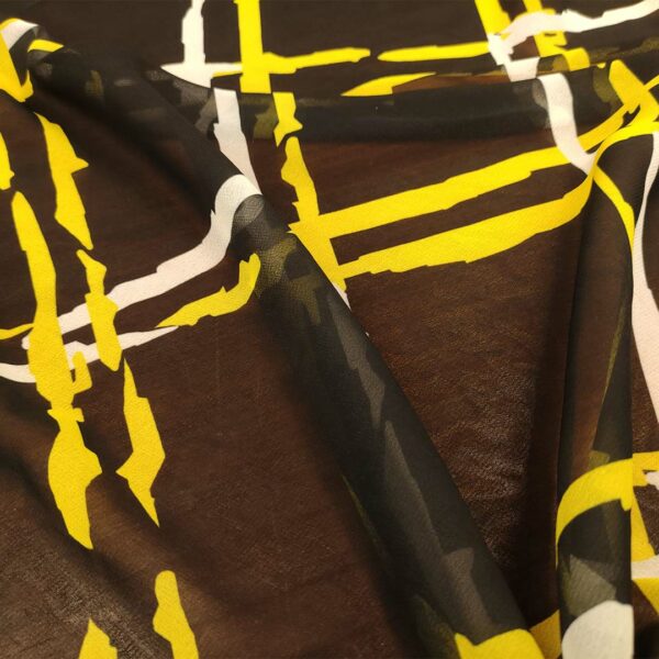 Tessuto Georgette a fantasia motivo astratto nero - giallo - bianco