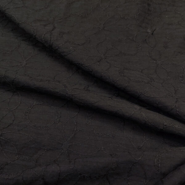 Tessuto Mussola di Cotone ricamato tinta unita motivo floreale nero