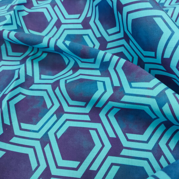 Tessuto Popeline di cotone a fantasia motivo geometrico turchese - blu