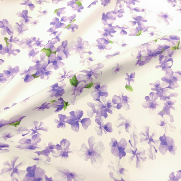 Tessuto Rasatello di Cotone a fantasia motivo floreale bianco - lilla