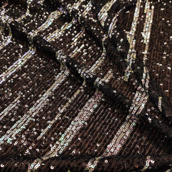 Tessuto Tulle elasticizzato ricamato con paillettes motivo astratto nero - aurora borale
