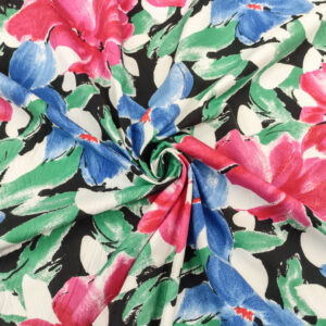 Tessuto Cotone leggero a fantasia motivo floreale nero - azzurro - fucsia