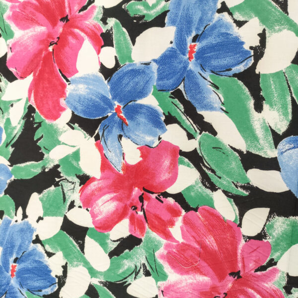Tessuto Cotone leggero a fantasia motivo floreale nero - azzurro - fucsia