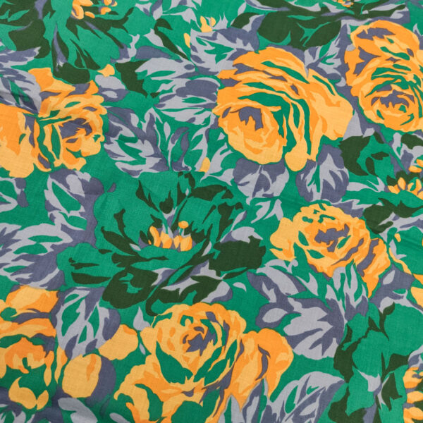 Tessuto Cotone leggero a fantasia motivo floreale verde - arancio - viola
