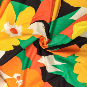 Tessuto Cotone leggero a fantasia motivo floreale verde - giallo - arancio