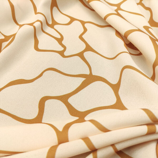 Tessuto Crepe a fantasia motivo astratto beige - panna