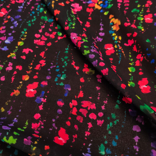 Tessuto Georgette a fantasia motivo astratto nero - fucsia - verde