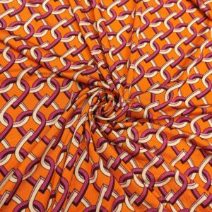 Tessuto Jersey a fantasia motivo geometrico arancione - viola - bianco