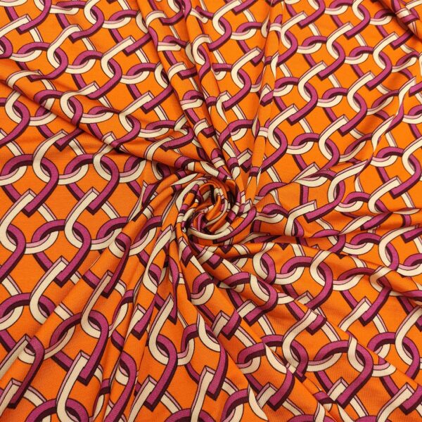 Tessuto Jersey a fantasia motivo geometrico arancione - viola - bianco
