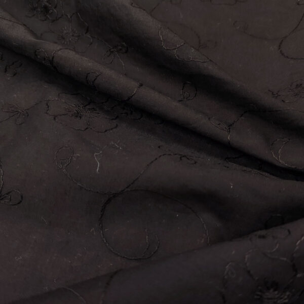 Tessuto Mussola di Cotone ricamato motivo floreale tinta unita nero