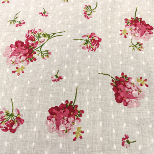 Tessuto Plumetis puro cotone a fantasia motivo floreale bianco - rosa - geranio