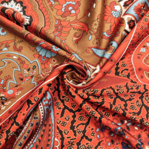 Tessuto Satin a fantasia motivo floreale cashmere arancio - nero - azzurro