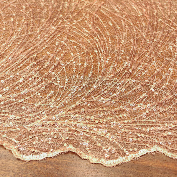 Tessuto Tulle ricamato con paillettes motivo astratto pesco