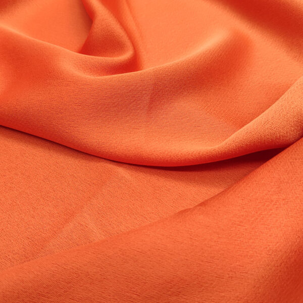 Tessuto Crepe Cady elasticizzato tinta unita arancione