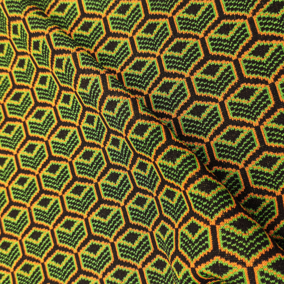 Tessuto Maglia Mano Lana a fantasia motivo geometrico verde - nero - arancione