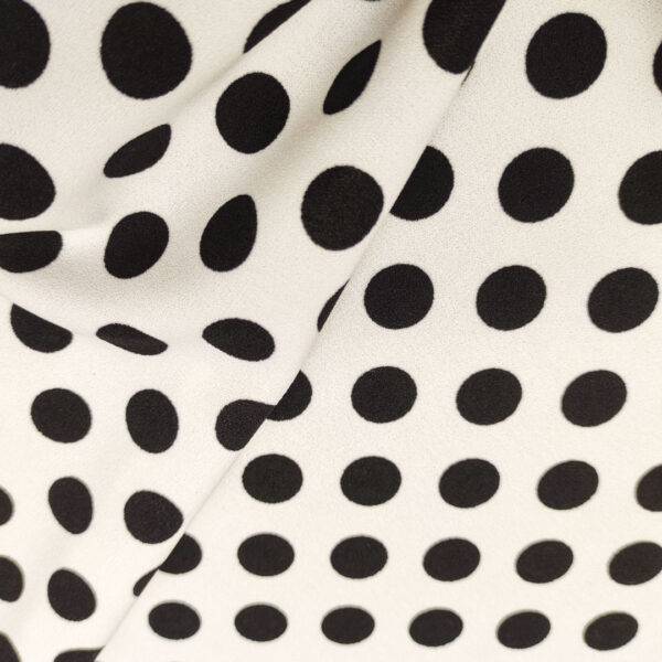 Tessuto Scuba Crepe a fantasia motivo pois bianco - nero