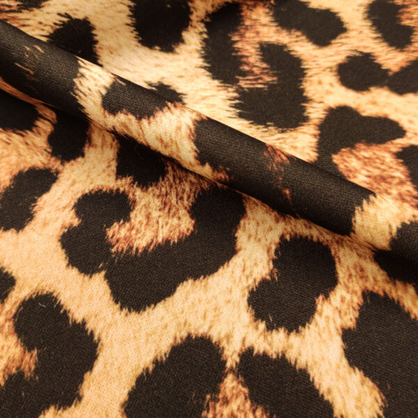 Tessuto Scuba Crepe a fantasia motivo animalier champagne - nero - marrone