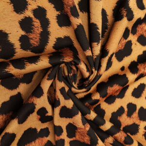 Tessuto Scuba Crepe a fantasia motivo animalier cuoio - ruggine - marrone