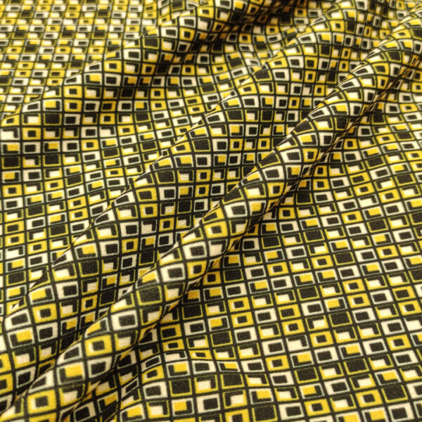 Tessuto Scuba Crepe a fantasia motivo geometrico nero - panna - giallo