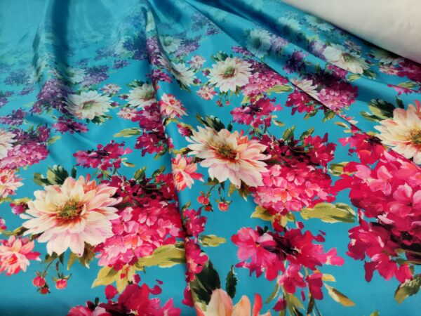 Tessuto Duchesse a fantasia motivo floreale turchese - fucsia
