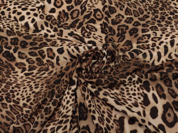 Tessuto Georgette a fantasia motivo animalier beige - marrone