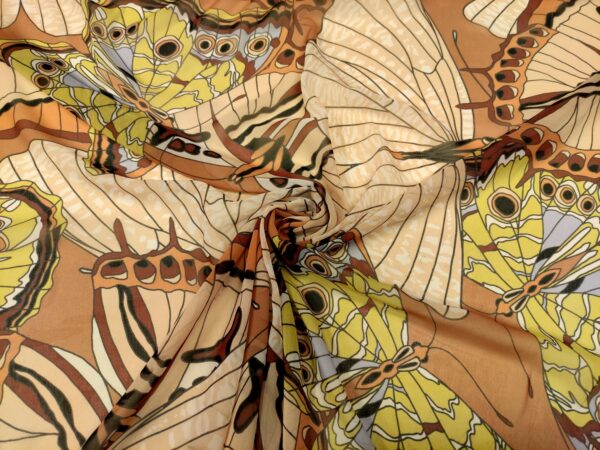 Tessuto Georgette a fantasia motivo astratto beige - giallo