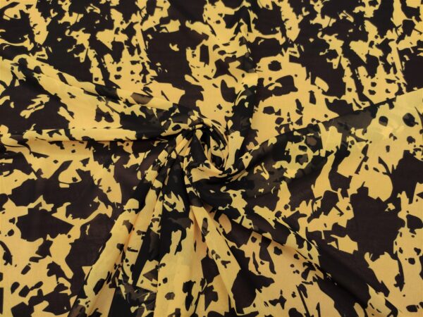 Tessuto Georgette a fantasia motivo astratto giallo - nero