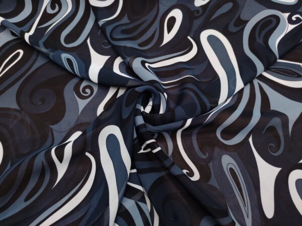 Tessuto Georgette a fantasia motivo astratto nero - grigio